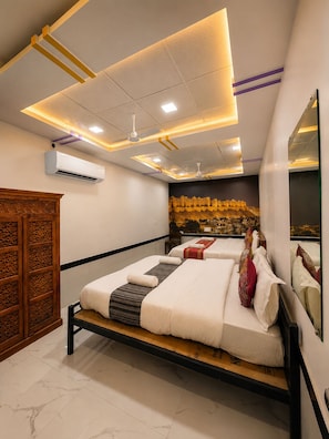 A modern hotel room with a large bed, a wooden cabinet, and a cityscape mural on the wall.