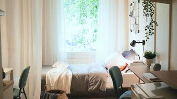 Desk, laptop workspace, free WiFi, bed sheets