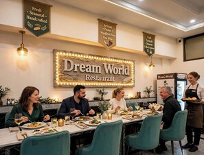 A restaurant interior with a sign reading 'Dream World Restaurant.' - Hotel Dream World (New Delhi)