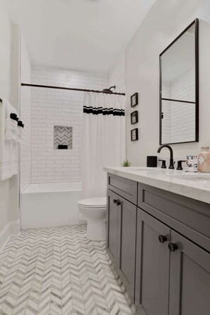 Shower, hair dryer, towels, shampoo