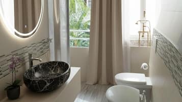 Jetted bath, rainfall showerhead, hair dryer, bidet