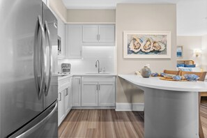 Fridge, microwave, stovetop, coffee/tea maker