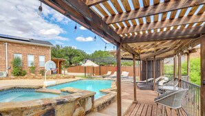A wooden deck with a pool, lounge chairs, and a basketball hoop. - Outdoor Oasis w/ Lake Views: Ransom Canyon Retreat (Ransom Canyon)