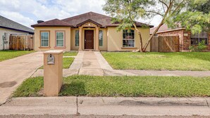A single-story house with a front porch, a mailbox, and a well-maintained lawn. - 4 Mi to Dtwn Brownsville: Family Home w/ Yard! (Brownsville)