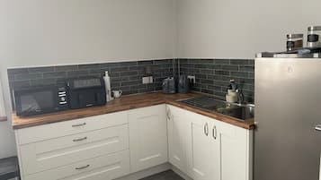 Fridge, microwave, toaster, cookware/dishes/utensils