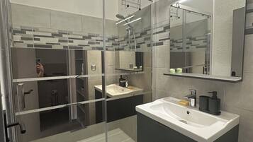 Shower, hair dryer, towels, soap