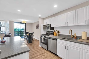 Apartment, 2 Bedrooms | Private kitchen | Fridge, oven, coffee/tea maker, toaster