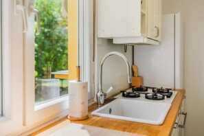 Family Apartment, Multiple Bedrooms (Central Cozy 2 Bedroom Apartment) | Private kitchen | Fridge, oven, stovetop, dishwasher