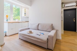 Family Apartment, Multiple Bedrooms (Central Cozy 2 Bedroom Apartment) | Living area | 21-inch flat-screen TV with digital channels