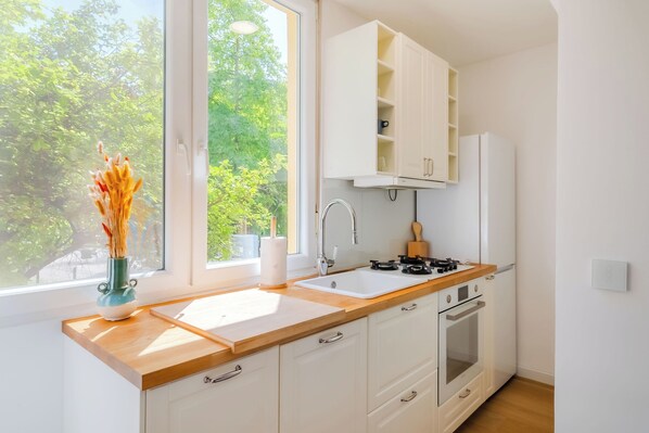 Family Apartment, 2 Bedrooms (Central Cozy 2 Bedroom Apartment) | Private kitchen | Fridge, oven, stovetop, dishwasher