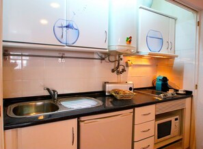 Microwave, coffee/tea maker, cookware/dishes/utensils