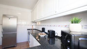 Microwave, coffee/tea maker, cookware/dishes/utensils