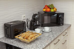 Microwave, coffee/tea maker, cookware/dishes/utensils