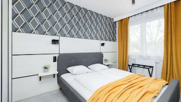 1 bedroom, desk, iron/ironing board, travel crib