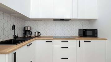 Fridge, microwave, stovetop, coffee/tea maker