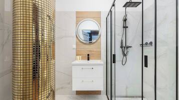 Shower, hair dryer, towels, shampoo