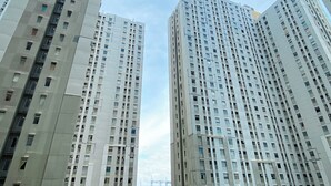 Two high-rise residential buildings with multiple balconies and windows. - Warm And Homey 2Br Apartment At Green Bay Pluit (Jakarta)