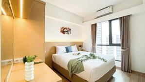 A modern bedroom with a bed, bedside table, and a large window with curtains.
