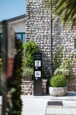 A stone building with a sign indicating a casino and reception.