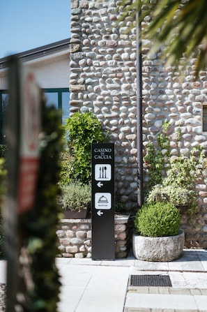 A stone building with a sign indicating a casino and reception.