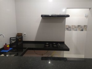 Fridge, stovetop, toaster, cookware/dishes/utensils