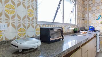 Apartment | Private kitchen | Toaster oven, paper towels, dining tables