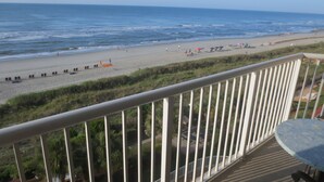 A balcony with a view of a beach and ocean. - N.Myrtle Beach Oceanfront 2BR, July 20-27 Shorecrest Vacation Villas I resort (North Myrtle Beach)