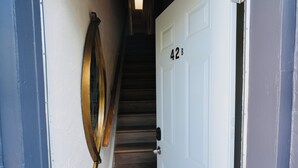 A staircase leading to a door marked with the number 42.