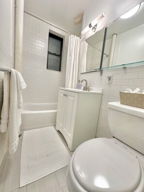 Hair dryer, towels, soap, toilet paper