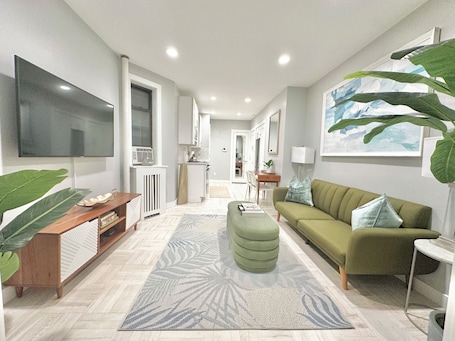 Living area. Chic Clean Renovated 1-bedroom Home with fast WiFi, laundry room in NYC