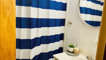 Shower, towels, soap, toilet paper