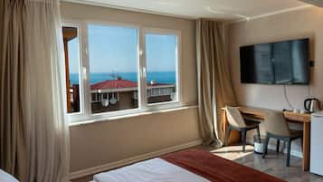 Premium Triple Room | Minibar, in-room safe, desk, laptop workspace
