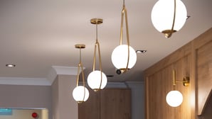 A modern kitchen with wooden cabinets, a black countertop, and pendant lighting. - THE MU CITY HOTEL (Trabzon)