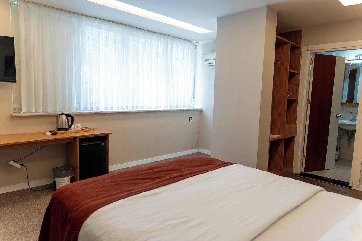 Superior Double Room | Minibar, in-room safe, desk, laptop workspace