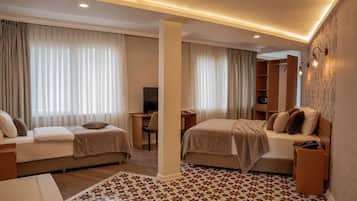 Executive Quadruple Room, Non Smoking | Minibar, in-room safe, desk, laptop workspace