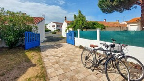 A paved pathway leading to a gated entrance with a bicycle parked nearby. - 1 bedroom gorgeous home in La Tranche-sur-Mer (La Tranche-sur-Mer)
