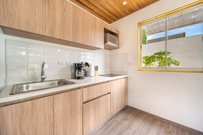 Fridge, microwave, stovetop, coffee/tea maker - Charming condo with pool views, gated access, outdoor lounge & grill area (Playas del Coco)