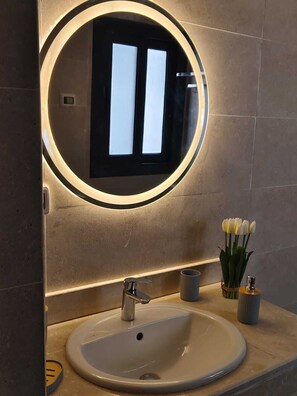 Bidet, towels, soap, toilet paper