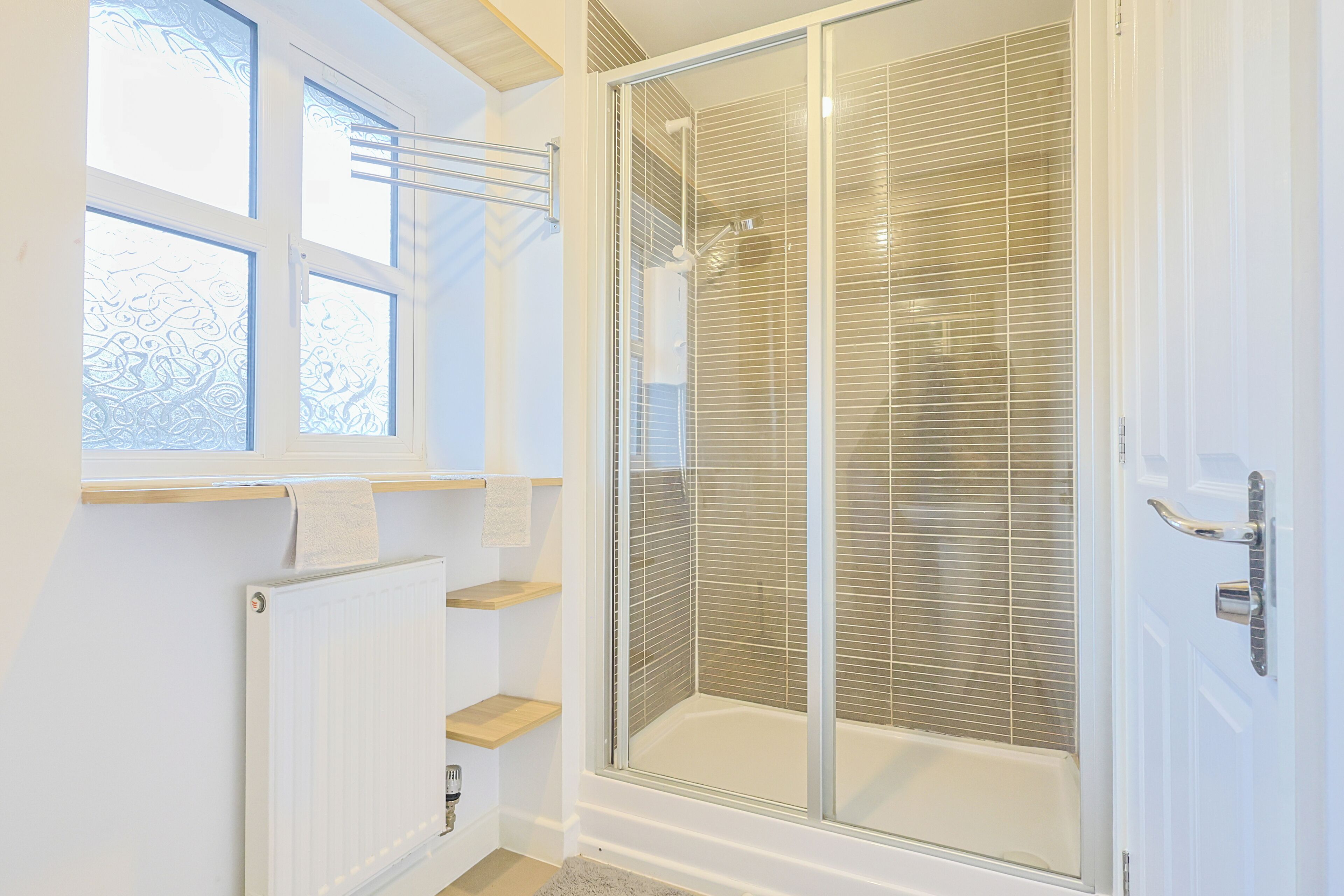 Shower, hair dryer, towels, toilet paper