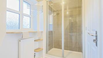Shower, hair dryer, towels, toilet paper