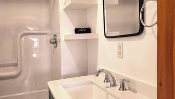 Shower, hair dryer, towels
