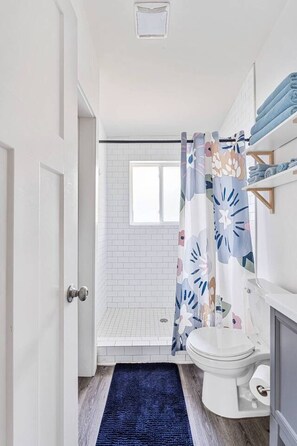 Shower, hair dryer, towels, soap