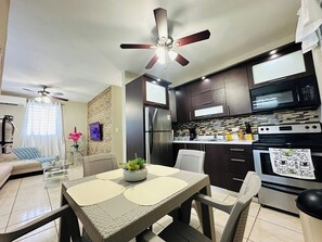Fridge, microwave, stovetop, coffee/tea maker