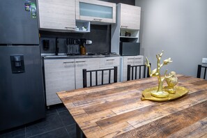 Fridge, microwave, stovetop, coffee/tea maker