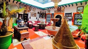 A traditional Moroccan interior with a high ceiling, ornate decor, and a central fountain. - Authentic Riad in Marrakech - A Living Museum of Moroccan Art (Marrakech)