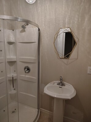Shower, towels, soap, toilet paper