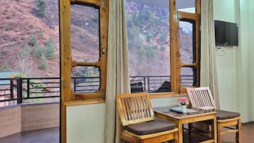 Superior Room, Balcony, Mountain View | Living area | 32-inch LCD TV with cable channels