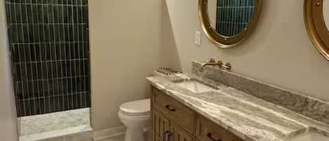 Shower, towels, soap, toilet paper