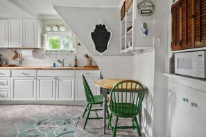 Fridge, microwave, coffee/tea maker, cookware/dishes/utensils