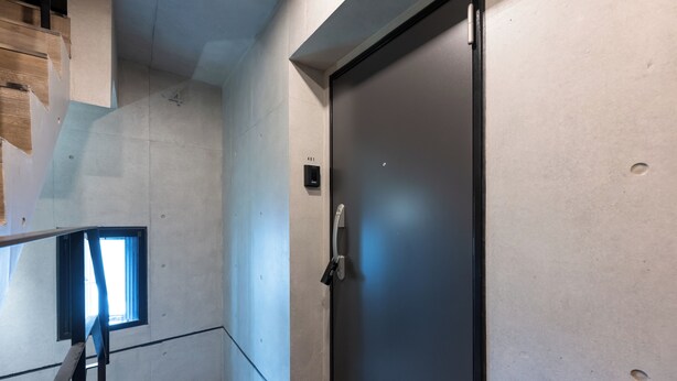 A modern elevator with a metallic door and a small window at the top. - Less than 10 minutes from each of Shibuya, Shinjuku and Harajuku/ Central location/ New construction/ Max. 6 people (渋谷区)